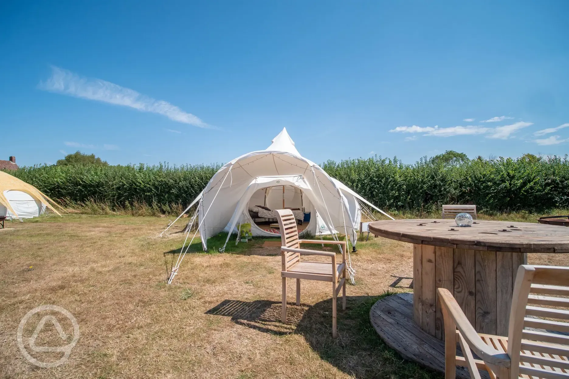 Standard bell tent with an outdoor picnic table