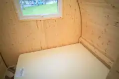 Family camping pod interior with a double bed (bring own bedding)