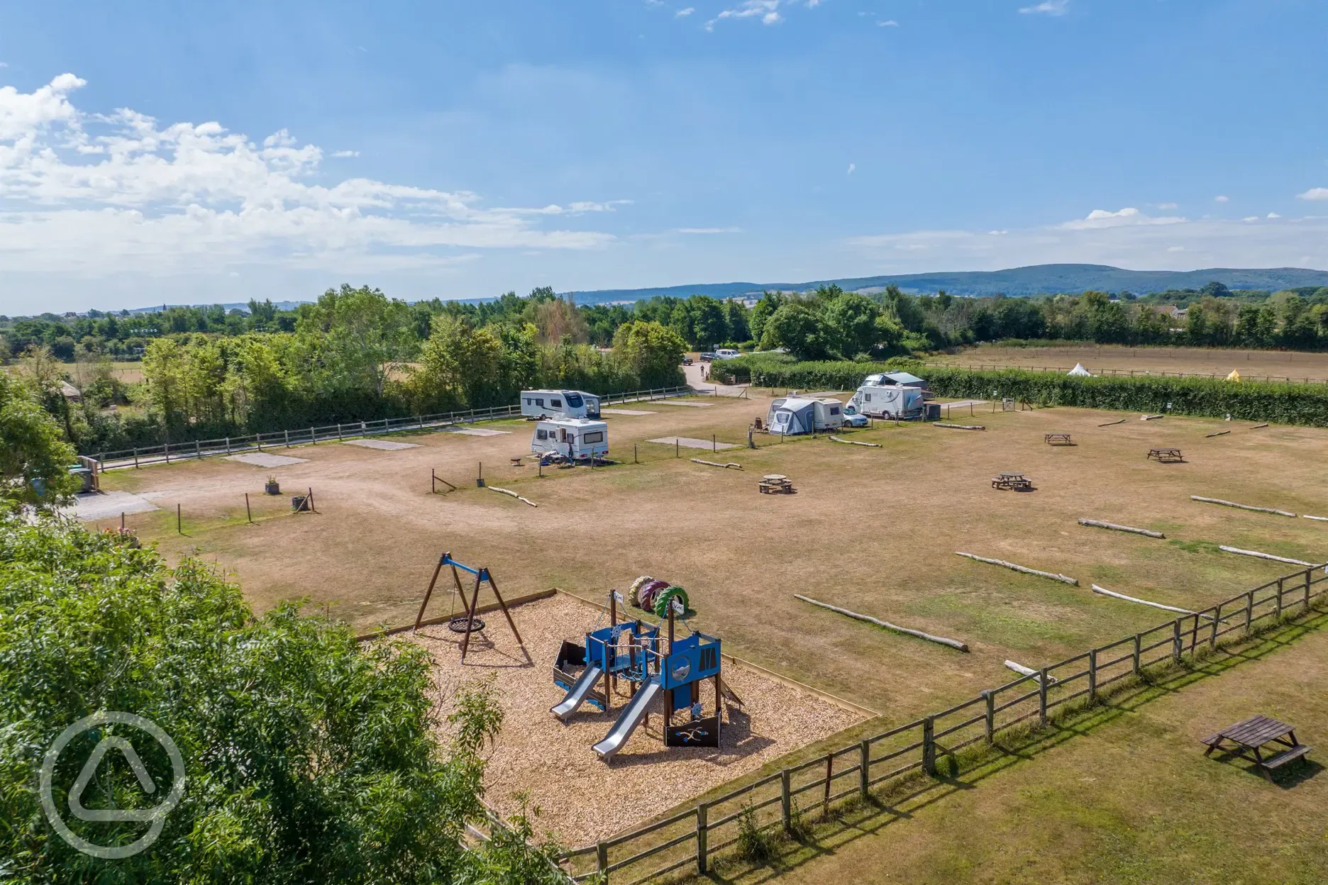 Aerial of grass and hardstanding pitches with the play park