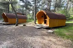 Four person camping pod exterior with private decking Four person camping pod exterior with private decking