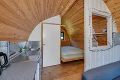 Ensuite Cosy glamping pod double bed and kitchen area
