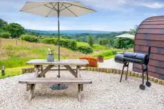 Wild Thyme pod outdoor area with countryside views