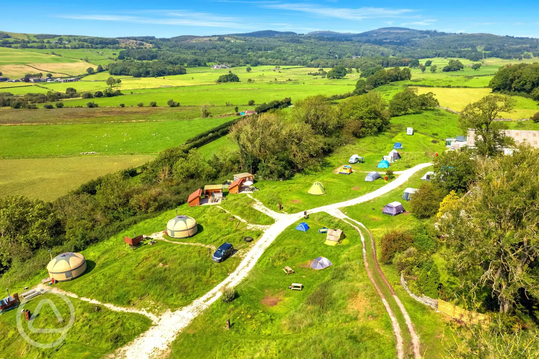 Aerial view of yurts, mini lodge pods and camping pitches 