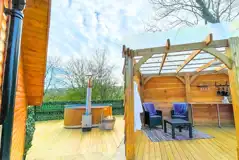 Mini lodge pod with hot tub