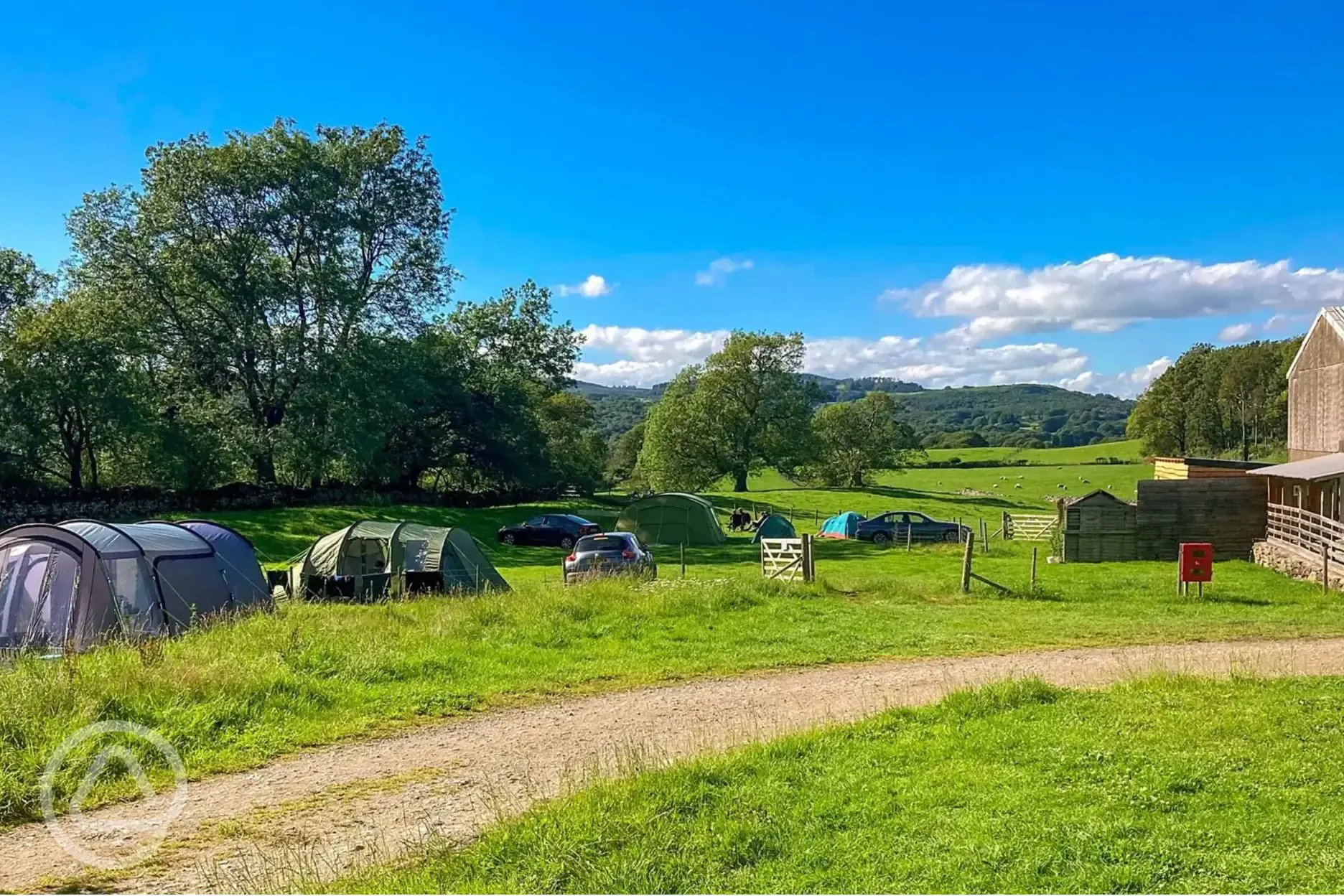 Grass pitches at Moss Howe Farm with facilities block