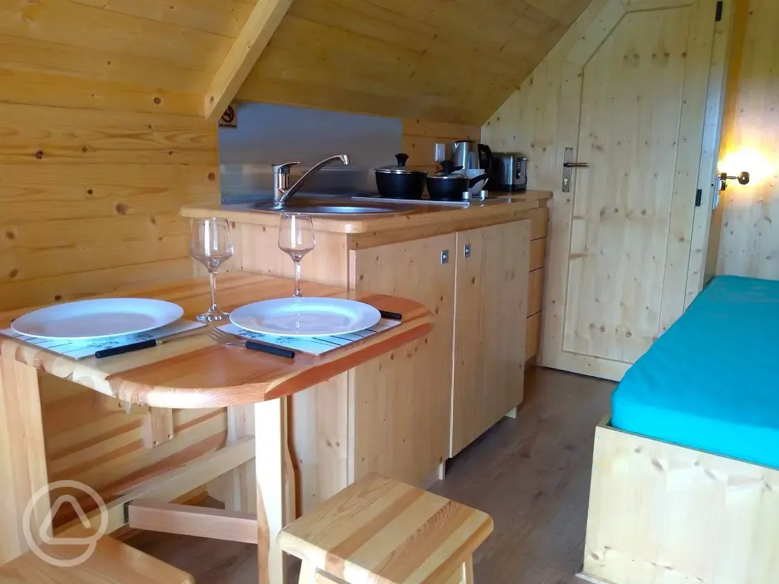 Mini lodge pod kitchenette and dining area