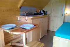 Mini lodge pod kitchenette and dining area