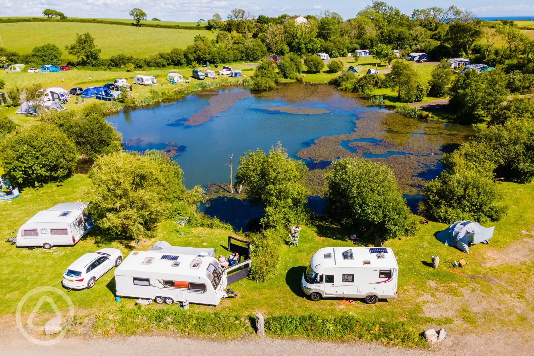 Aerial of electric lake view grass pitches