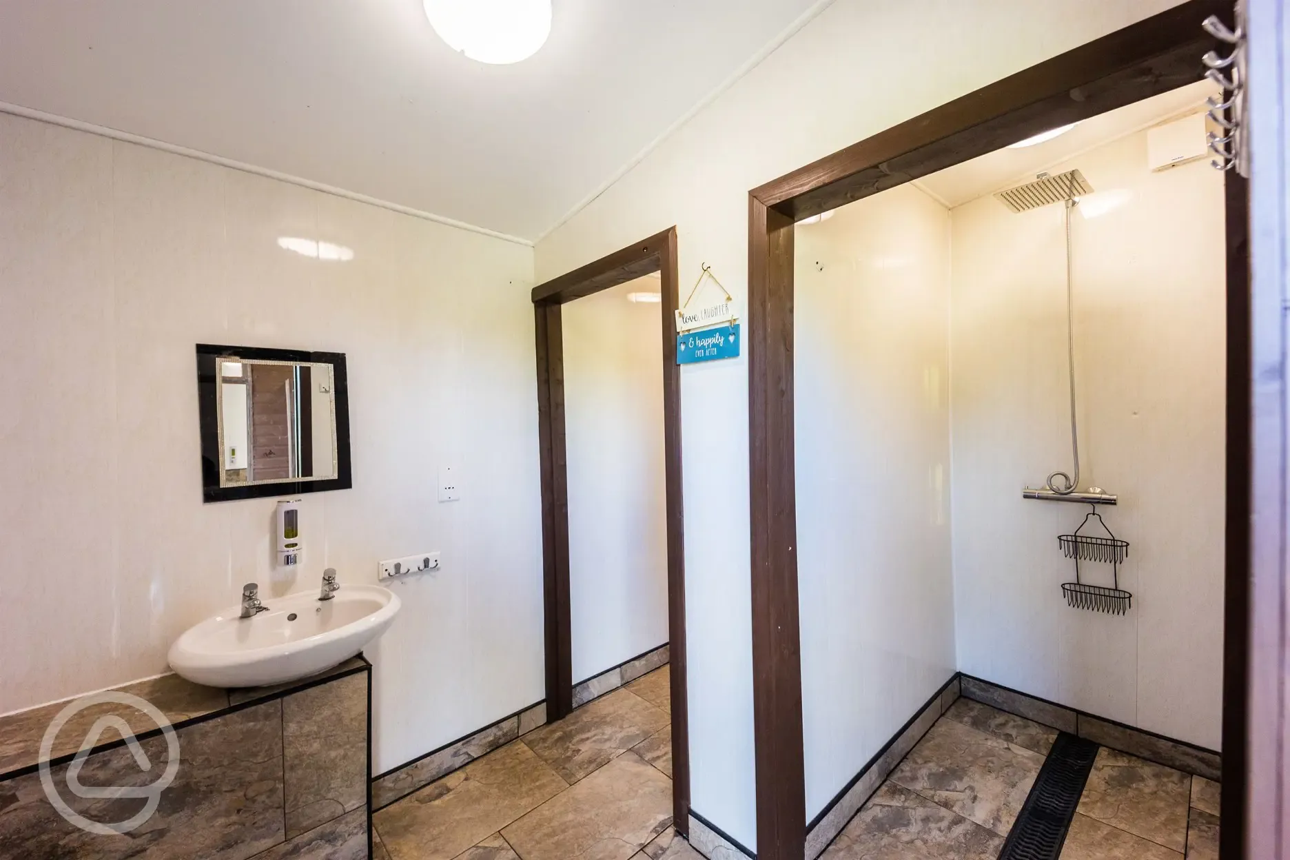 Showers with hooks and shelves for toiletries