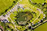 Aerial of Carn Springs with a central lake