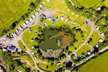 Aerial of Carn Springs with a central lake
