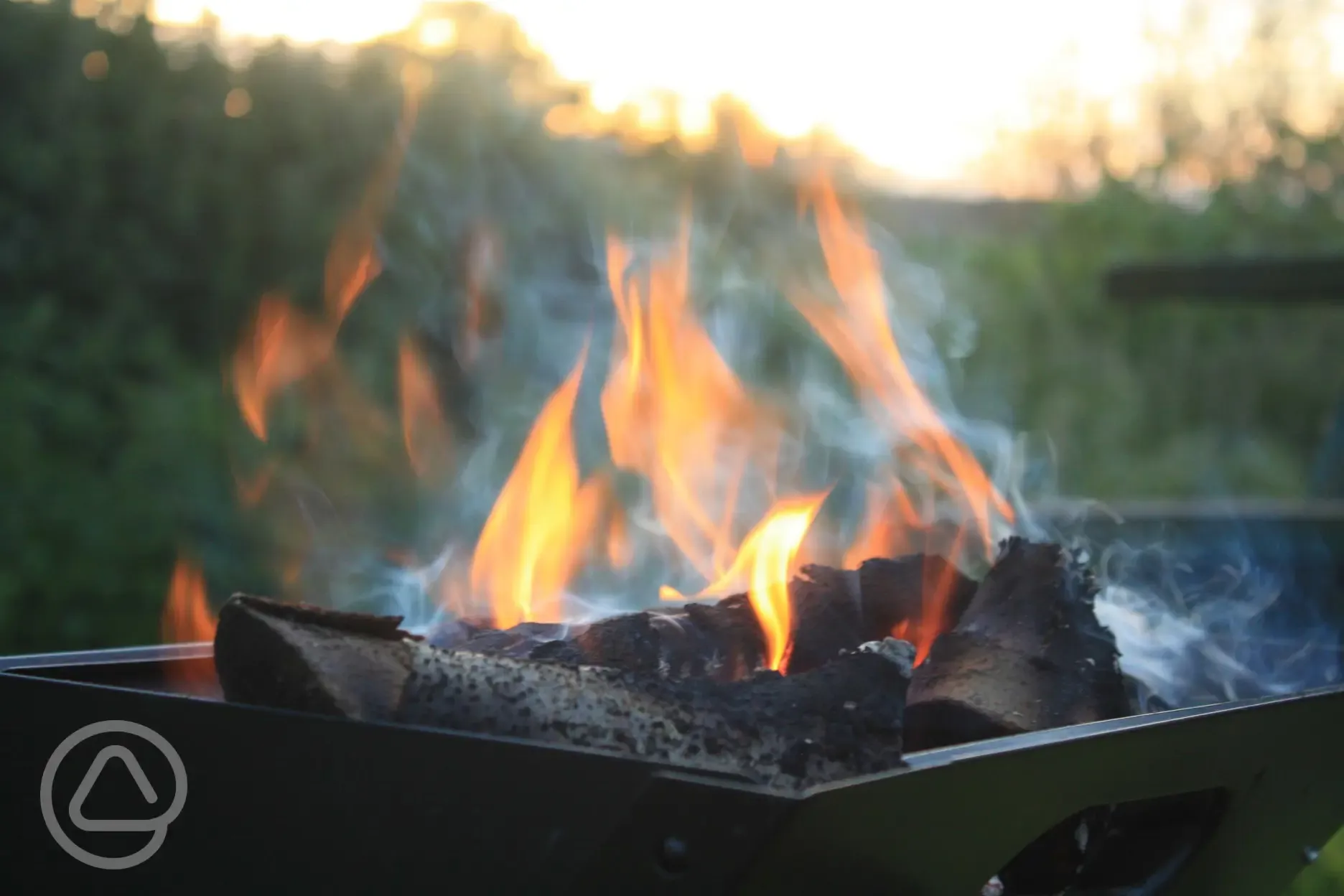 Campfires off the ground in a fire pit or bbq
