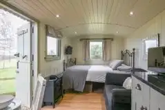 Shepherd's hut interior at Hay and Hedgerow Glamping