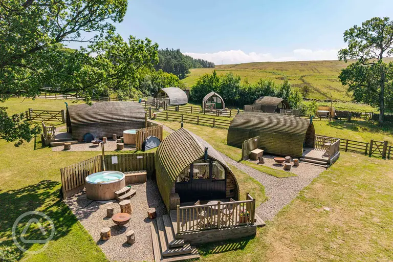 Glamping pods, some with optional wood-fired hot tubs