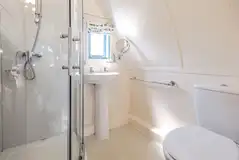 The Wheatley's ensuite with a toilet, shower, sink and shaver socket The Wheatley's ensuite with a toilet, shower, sink and shaver socket