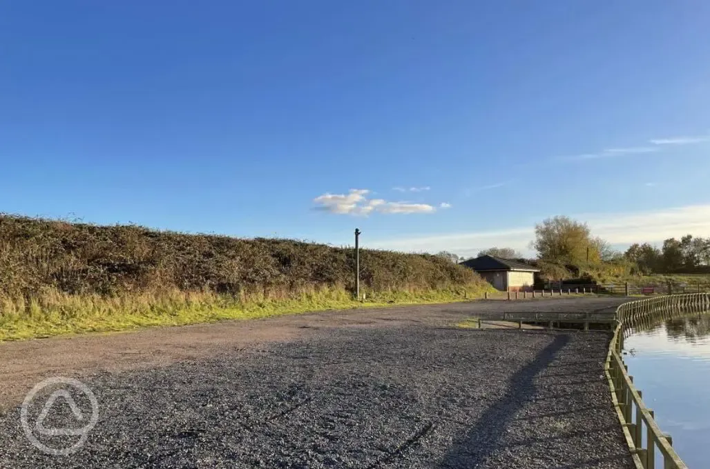 Electric hardstanding touring pitches by the lake