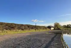 Electric hardstanding touring pitches by the lake