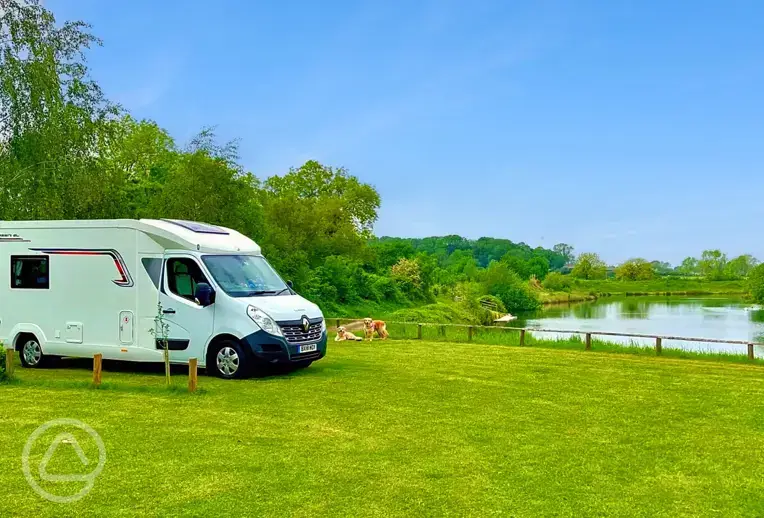 Lakeside electric grass touring pitches at Stanton Lakes