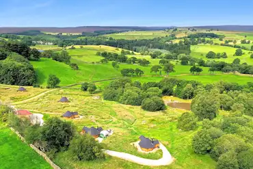 Aerial of Little Seed Field amongst woodland, ponds and countryside