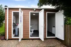 Onsite shared washroom facilities for standard glamping cabins