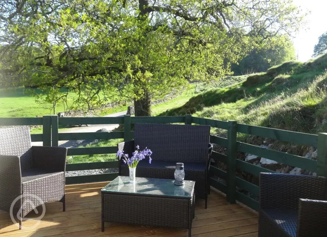 Shepherd's hut decking and outdoor seating