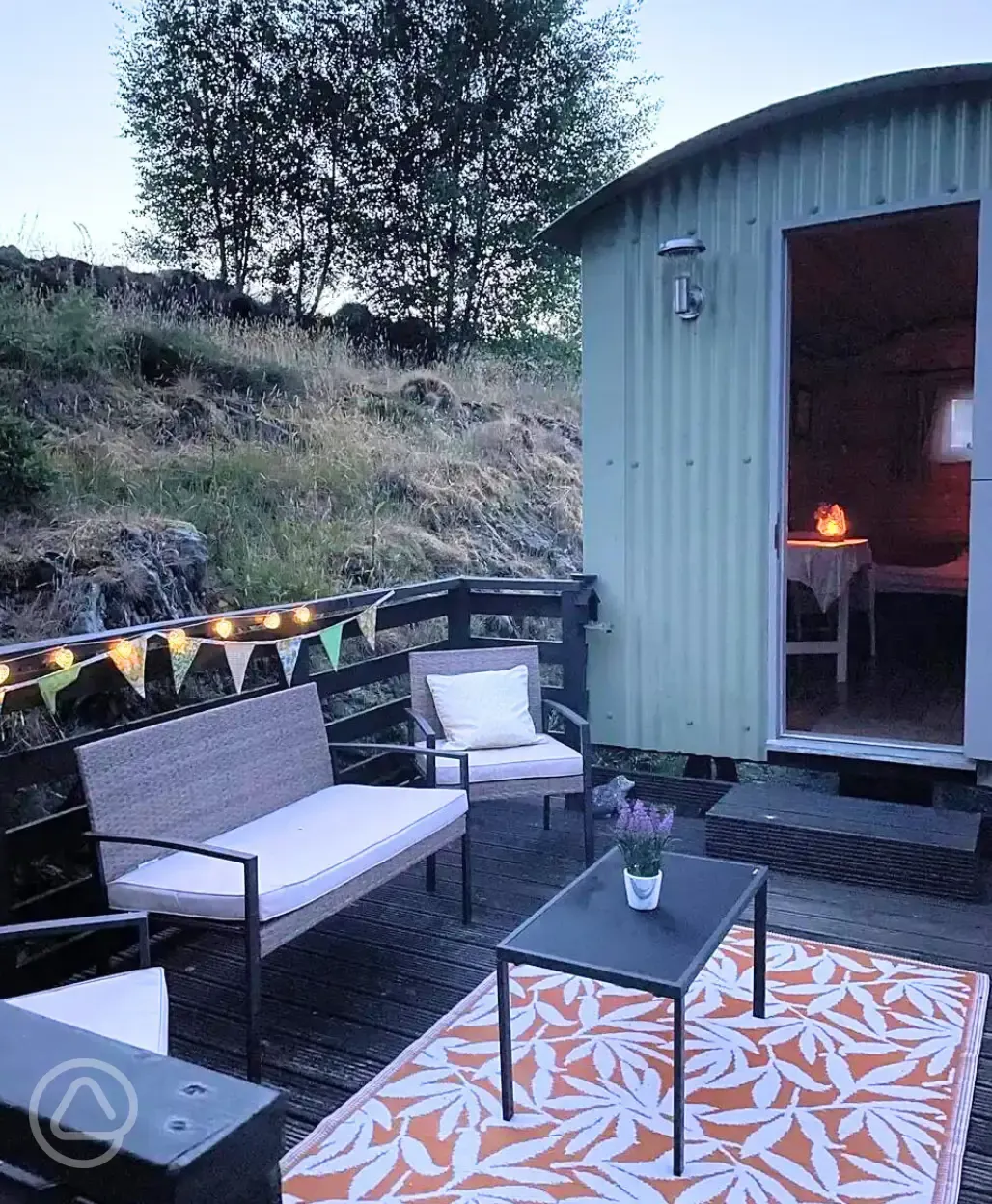 Shepherd's hut decking and outdoor seating