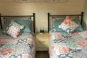 Twin beds at Cherryberry Lodges