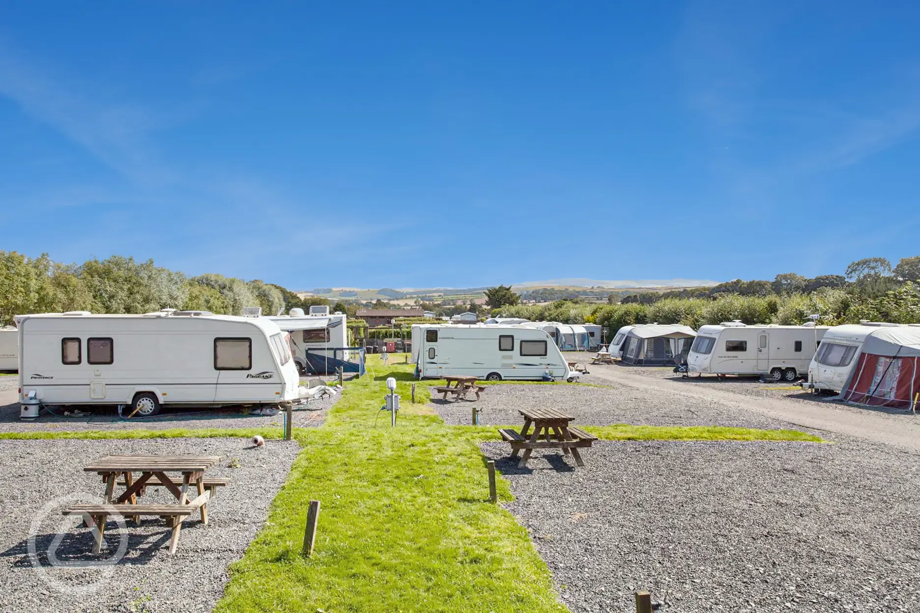 Electric hardstanding super pitches with nearby picnic tables at Coldingham Bay