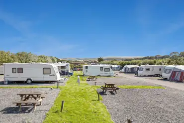 Electric hardstanding super pitches with nearby picnic tables at Coldingham Bay