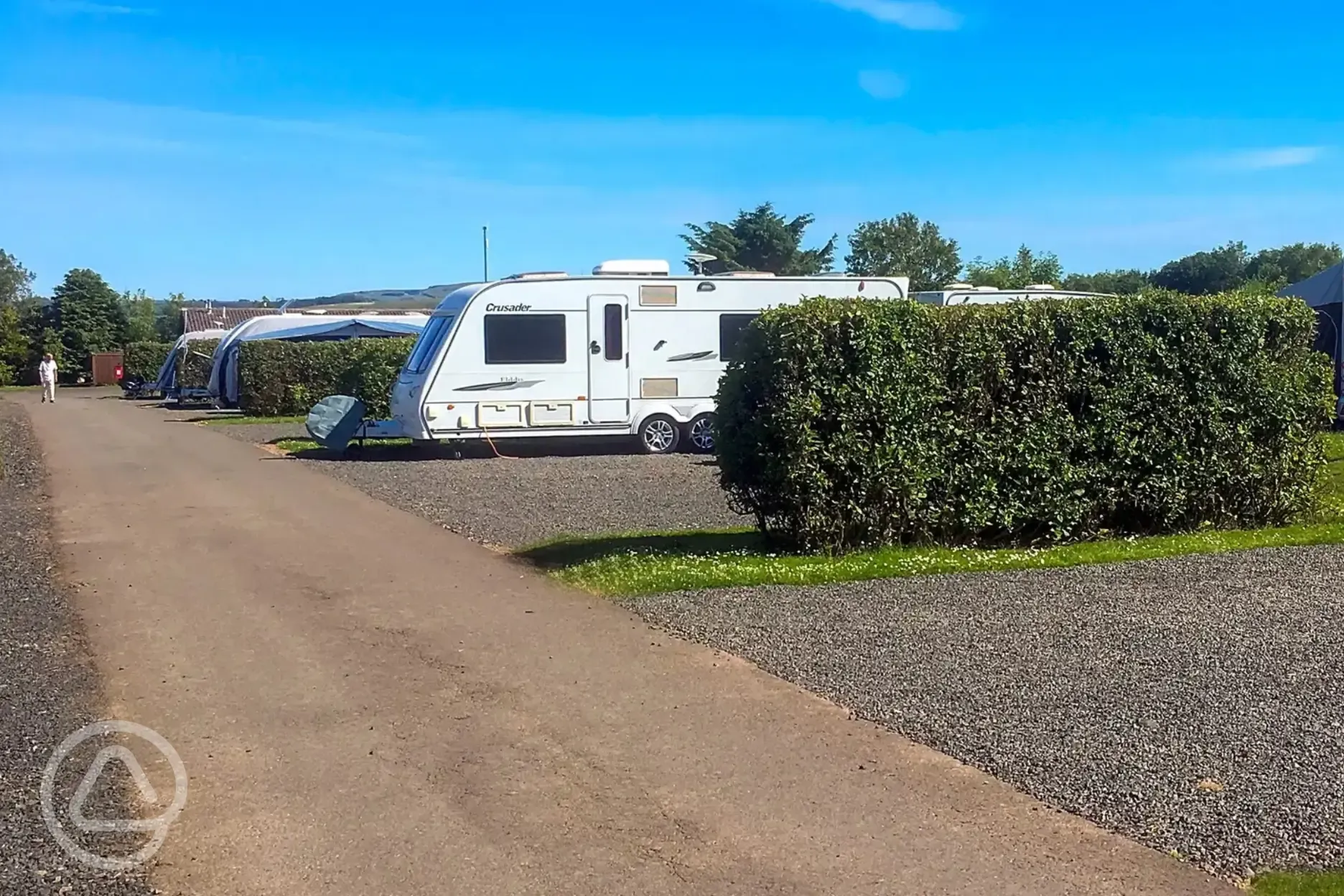 Twin axel on electric hardstanding pitches with a private hedging