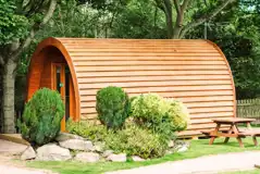 Camping pod with planting around the site