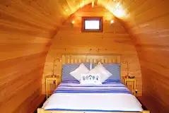 Posh Pod interior with a double bed, kitchenette, electric and more Posh Pod interior with a double bed, kitchenette, electric and more