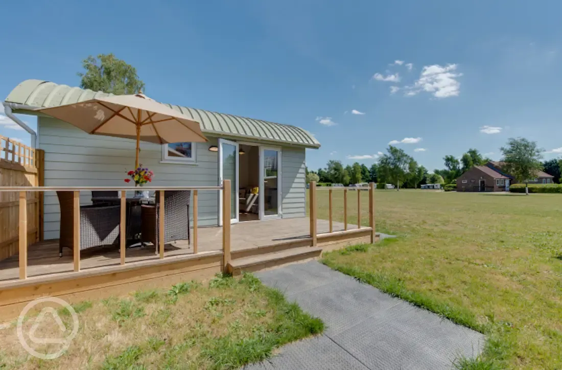 Family shepherds cabin terrace area