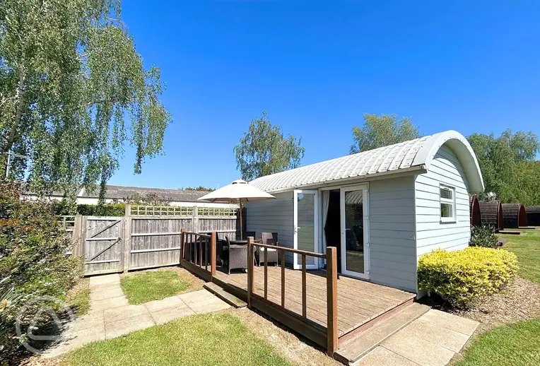 Shepherd's cabins with decking area and outdoor seating
