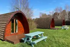 Camping pods with picnic tables and fire pits Camping pods with picnic tables and fire pits