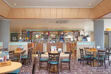 The Boardwalk Bar and Restaurant indoor seating area at Ruda Holiday Park