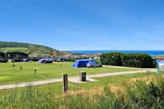 Electric grass tent pitches (6.5m x 5.5m) with 16 amp electric hook up