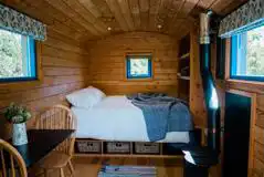 Small woods shepherd's hut double bed and log burner