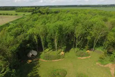 Overview of the site in woodland New Farm Holidays