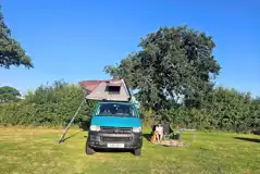 Campervan and roof tent on a Rabbit non electric grass pitch Campervan and roof tent on a Rabbit non electric grass pitch