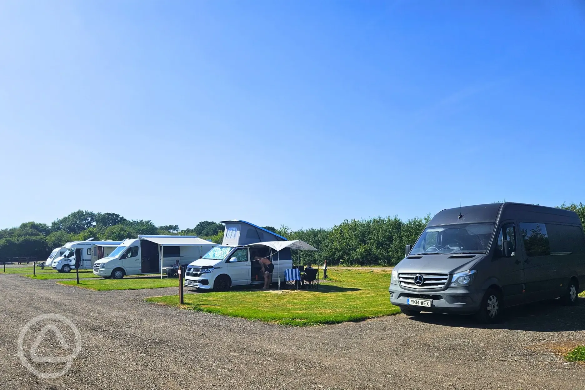 Badger large electric hardstanding and grass touring pitches at Manor Farm
