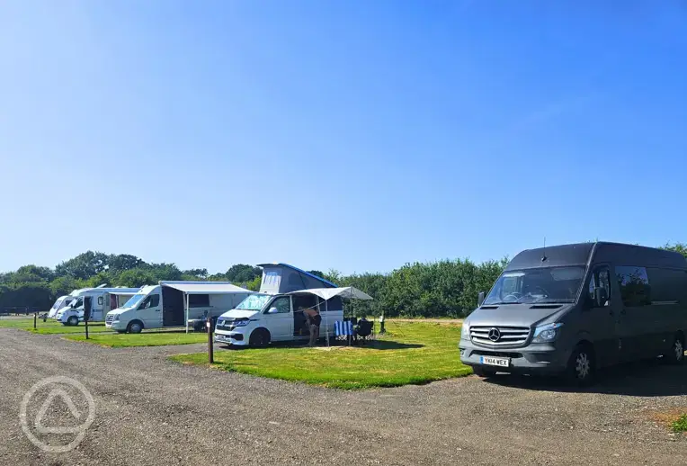 Badger large electric hardstanding and grass touring pitches at Manor Farm