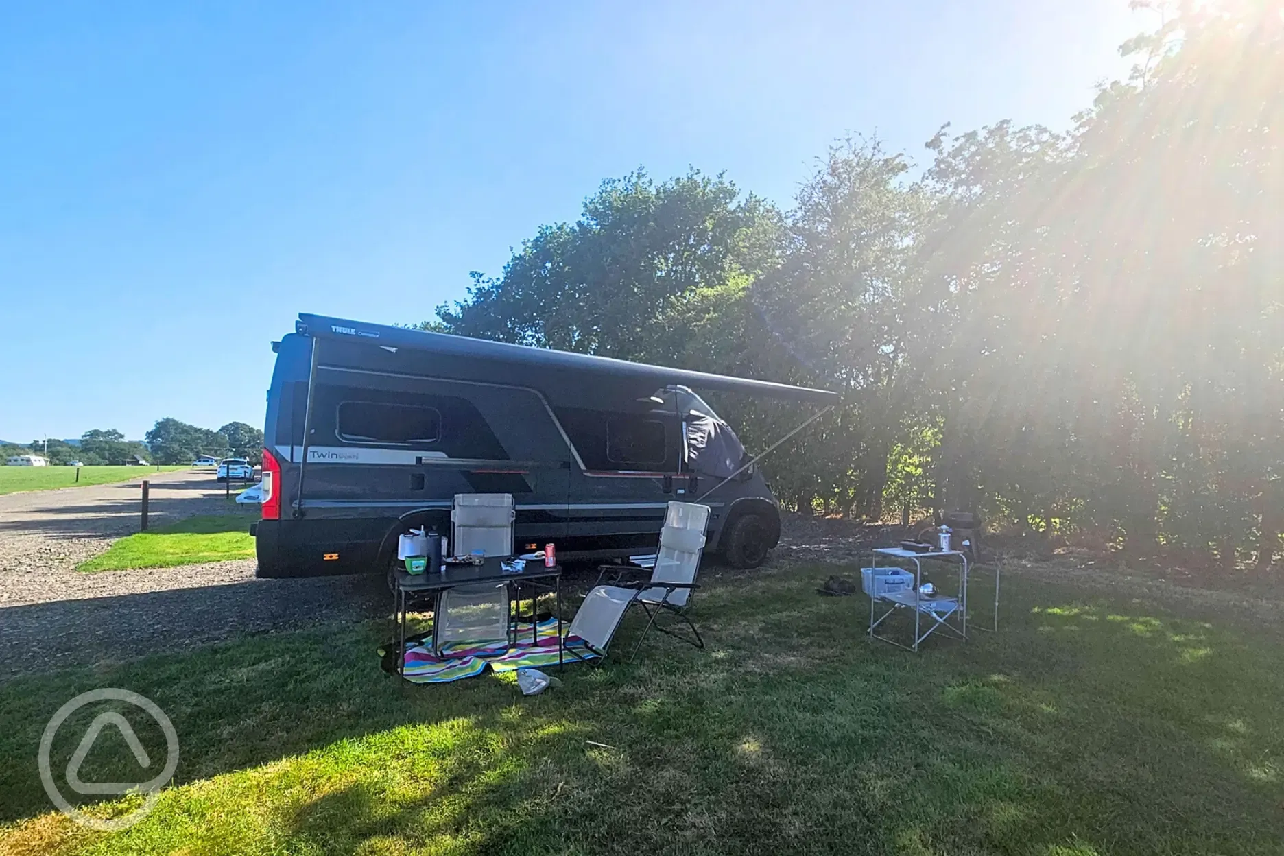 Campervan on a Badger large electric hardstanding and grass touring pitch