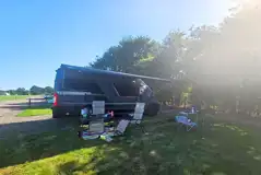 Campervan on a Badger large electric hardstanding and grass touring pitch Campervan on a Badger large electric hardstanding and grass touring pitch
