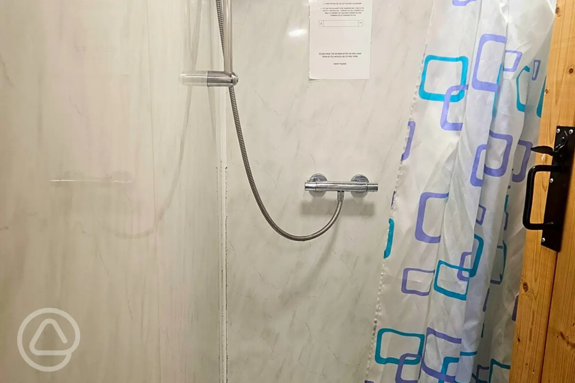 Showers with hot water and a shower curtain