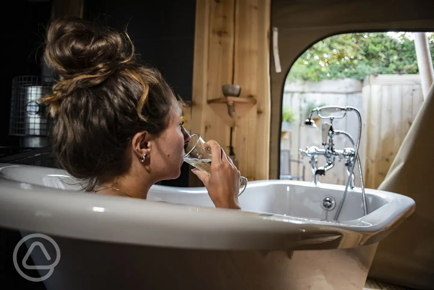 Soak in the slipper bath with a glass of something delicious