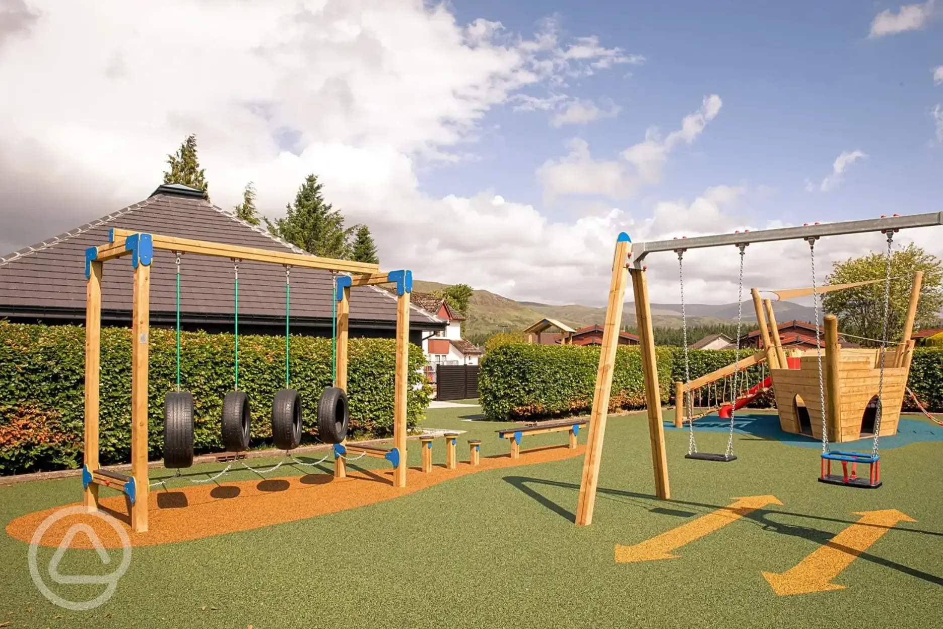 Children's playground with swings and assault course