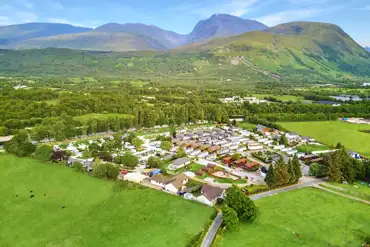 Aerial of Ben Nevis Holiday Park with mountains behind