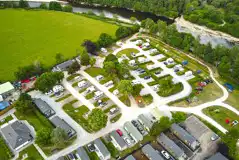 Aerial of hardstanding pitches, holiday lodges and static caravans