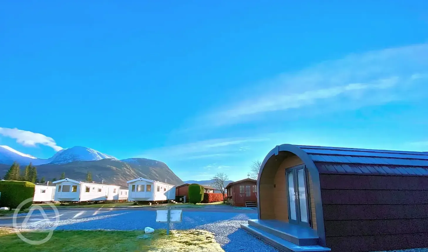 Glamping pods and static caravans exterior with mountain views